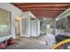 Covered porch with exterior access and storage at 1579 Dunlap Dr, Deltona, FL 32725