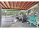 Screened porch with seating and storage space at 1579 Dunlap Dr, Deltona, FL 32725