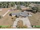 Aerial view of house, driveway, and yard at 1701 N Stone St, Deland, FL 32720