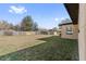Large grassy backyard with wooden fence and shed at 1701 N Stone St, Deland, FL 32720
