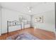 Spacious bedroom with wood floors and ceiling fan at 1701 N Stone St, Deland, FL 32720