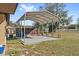 Covered carport with concrete slab and side yard at 1701 N Stone St, Deland, FL 32720
