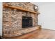 Brick fireplace with wooden mantel and hearth at 1701 N Stone St, Deland, FL 32720