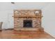 Brick fireplace with wood mantel in the living room at 1701 N Stone St, Deland, FL 32720