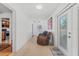 Bright hallway with kitchen peek and access to the backyard at 1701 N Stone St, Deland, FL 32720