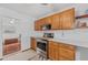 View of kitchen with wood cabinets and stainless steel appliances at 1701 N Stone St, Deland, FL 32720