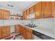 Kitchen features ample cabinetry and a double sink at 1701 N Stone St, Deland, FL 32720