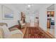 Open living space with hardwood floors and views into kitchen at 1701 N Stone St, Deland, FL 32720