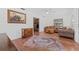 Living room with hardwood floors, sofa, and rug at 1701 N Stone St, Deland, FL 32720