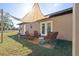 Relaxing patio area with shade sail and wicker furniture at 1701 N Stone St, Deland, FL 32720