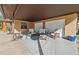 Covered patio with wicker furniture and plants at 1701 N Stone St, Deland, FL 32720