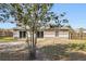 Spacious backyard with a large grassy area and mature trees at 1768 Santee Ave, Deltona, FL 32738