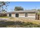 Shows the back of the house and a large backyard at 1768 Santee Ave, Deltona, FL 32738
