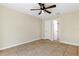 Bright bedroom featuring tile floors and a ceiling fan at 1768 Santee Ave, Deltona, FL 32738