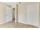 Bedroom with tile floors and double doors at 1768 Santee Ave, Deltona, FL 32738