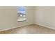 Simple bedroom with tile floors and a window at 1768 Santee Ave, Deltona, FL 32738