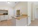 Kitchen boasts white cabinets, wood countertops, and built-in microwave at 1768 Santee Ave, Deltona, FL 32738