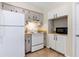This kitchen includes white appliances and wood countertops at 1768 Santee Ave, Deltona, FL 32738