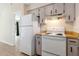 White appliances, wood countertops, and ample cabinet space at 1768 Santee Ave, Deltona, FL 32738