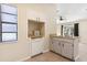 White cabinets, wood countertops, and a built-in dishwasher at 1768 Santee Ave, Deltona, FL 32738