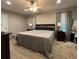 Large main bedroom with king-size bed and two nightstands at 1900 Knolton Ave, Orange City, FL 32763