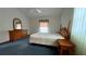 Spacious bedroom featuring a double bed, dresser, and carpeted floor at 208 Quaker Ridge Dr, Daytona Beach, FL 32119