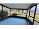 Screened porch overlooking backyard, perfect for relaxing at 208 Quaker Ridge Dr, Daytona Beach, FL 32119