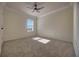 Bright bedroom with window and neutral wall tones at 210 Jacobs Landing Ct, Deland, FL 32724