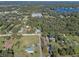 Aerial view showing house location near a lake at 2133 Eau Claire Ave, Deland, FL 32724