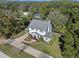 Two-story house with a large yard and driveway, seen from above at 2133 Eau Claire Ave, Deland, FL 32724