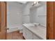 Bathroom with tub, toilet, vanity, lighting, and tiled flooring at 2170 Wilmhurst Rd, Deland, FL 32720