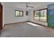 Bedroom featuring carpeted floors, two windows, and ample sunlight at 2170 Wilmhurst Rd, Deland, FL 32720