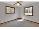 Cozy bedroom with natural light from two windows overlooking the outdoors at 2170 Wilmhurst Rd, Deland, FL 32720