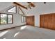 Sunlit bedroom features a ceiling fan, natural wood beams, and ample closet space at 2170 Wilmhurst Rd, Deland, FL 32720
