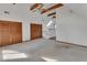 Bright bonus room with ceiling fan, wood beams, skylight and closet storage at 2170 Wilmhurst Rd, Deland, FL 32720