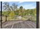 View of the fenced backyard from the wooden deck at 2170 Wilmhurst Rd, Deland, FL 32720