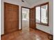 Entryway with terra cotta tile, natural light, and wooden doors leading into the home at 2170 Wilmhurst Rd, Deland, FL 32720