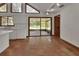 Bright kitchen with white cabinets, tile floor, and sliding glass doors to the outside at 2170 Wilmhurst Rd, Deland, FL 32720