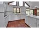 Well-lit kitchen with tiled floors, white cabinets, and an island countertop with a sink at 2170 Wilmhurst Rd, Deland, FL 32720