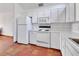 Functional kitchen featuring a white refrigerator, countertop, and an electric stove at 2170 Wilmhurst Rd, Deland, FL 32720