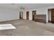Open living room with ceiling fan, carpeted floors, and neutral walls at 2170 Wilmhurst Rd, Deland, FL 32720