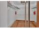 Walk-in closet featuring shelving and storage, as well as tile flooring at 2170 Wilmhurst Rd, Deland, FL 32720