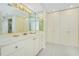 Bathroom with vanity, storage and access to closets at 2200 N Atlantic Ave # 1502, Daytona Beach, FL 32118