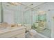 Bathroom with mirrored walls and updated vanity at 2200 N Atlantic Ave # 1502, Daytona Beach, FL 32118