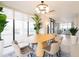 Elegant dining area with an oval table and stylish chairs at 2200 N Atlantic Ave # 1502, Daytona Beach, FL 32118