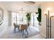 Modern dining room features a round table with chairs and large windows at 2200 N Atlantic Ave # 1502, Daytona Beach, FL 32118