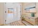 Bright entryway with console table and view into living area at 2200 N Atlantic Ave # 1502, Daytona Beach, FL 32118