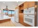 Updated kitchen featuring white appliances and wood cabinets at 2200 N Atlantic Ave # 1502, Daytona Beach, FL 32118