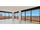Spacious living room with wall-to-wall windows and ocean view at 2200 N Atlantic Ave # 1502, Daytona Beach, FL 32118