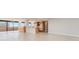 Open concept living room and kitchen with tile floors at 2200 N Atlantic Ave # 1502, Daytona Beach, FL 32118